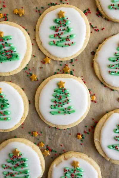 christmas cookie with white chocolate and christmas tree frosted on top 
