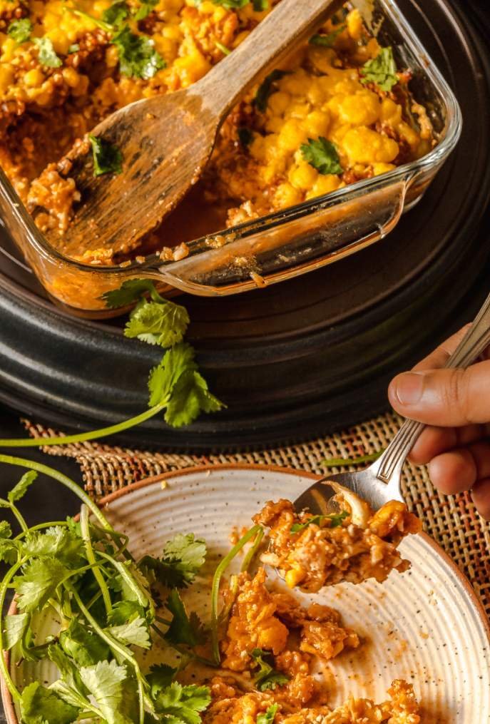 taking a spoonful of the casserole