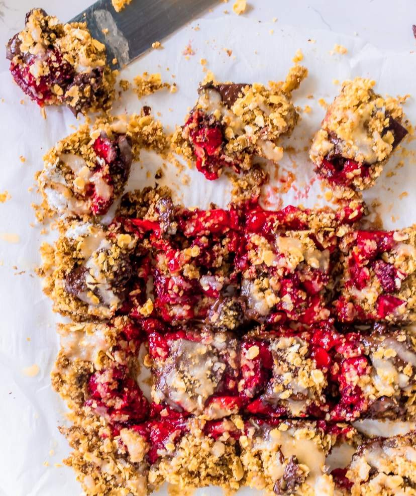 Healthy Strawberry Oatmeal Bars with Dark Chocolate Chunks kept on a parchment paper