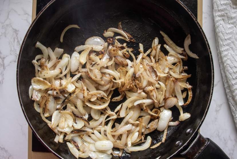 frying onions in a pan with ghee