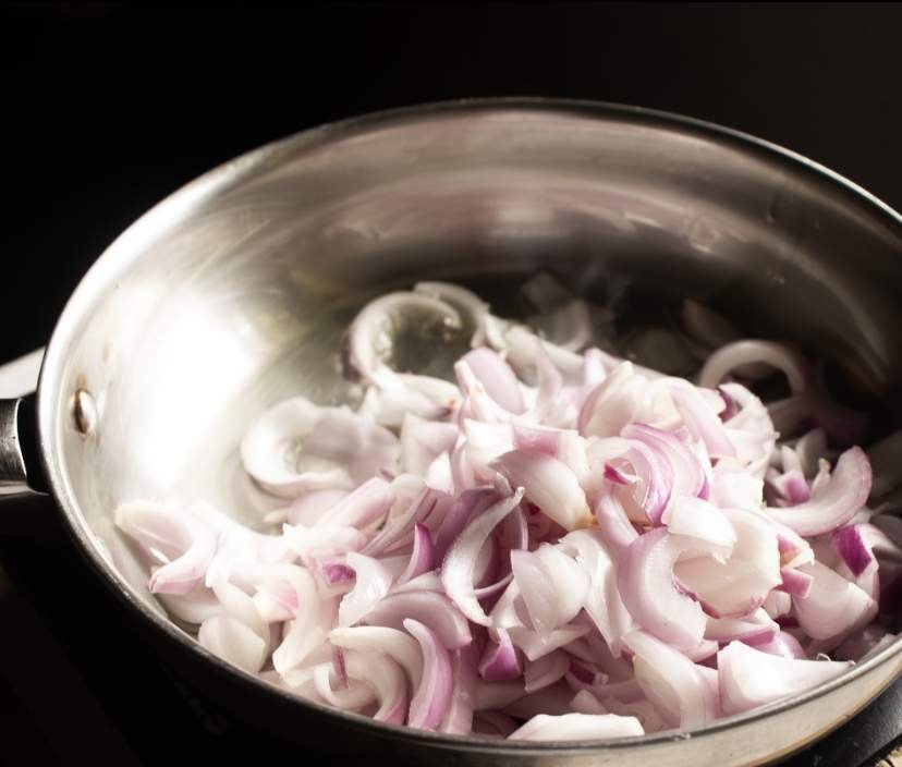 sauteeing onions in a skillet