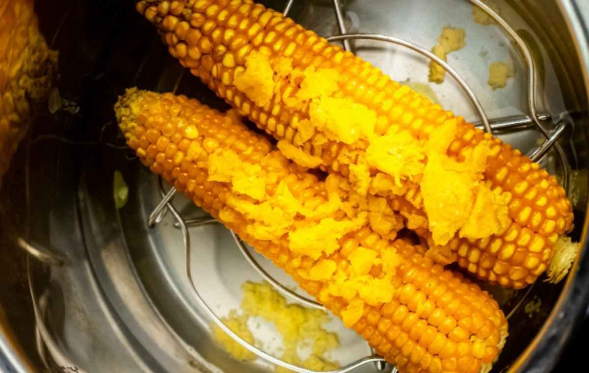 adding cheddar cheese over corn